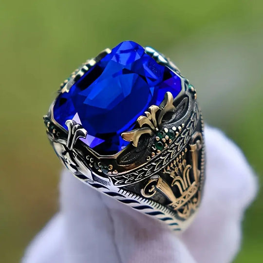 Anel Dourado com Safira Azul